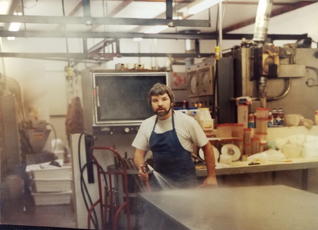 Northwest Sausage & Deli Dick cleaning up after processing meat