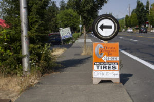 Olympia Motorcycle Tires Signage