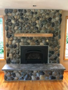 Professional Stone Products River rock fireplace after