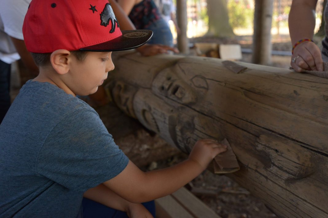 Younger child sanding