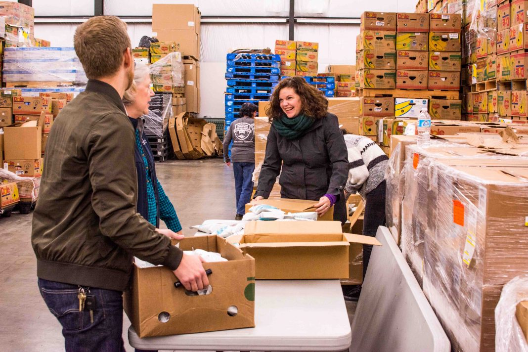 SPSCC Day of Caring Thurston County Food Bank Sorting Food