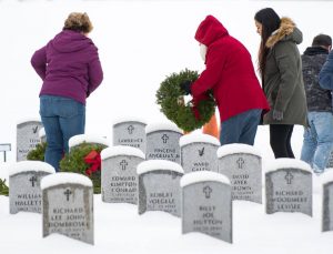 Wreaths Across America Washington State Veterans Cemetary putting out wreaths