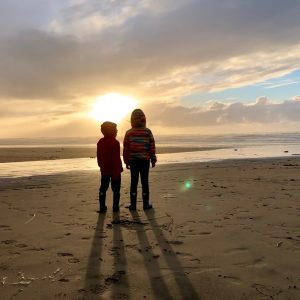 Playful Wisdom kids on beach