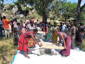 Friendly Water for the World Women sifting sand for filters