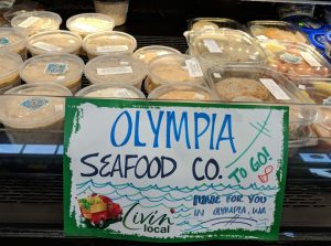 Spuds Produce Market Olympia Seafood company cold case sign