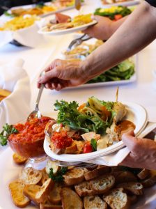 bayview catering spring 2019 hand with plate of food