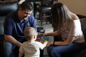 Cooley Sleep Parents reading with baby