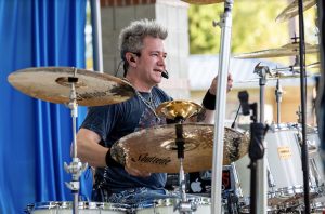 Lacey South Sound Chamber Thurston County Events Man on drums blue background South Sound event