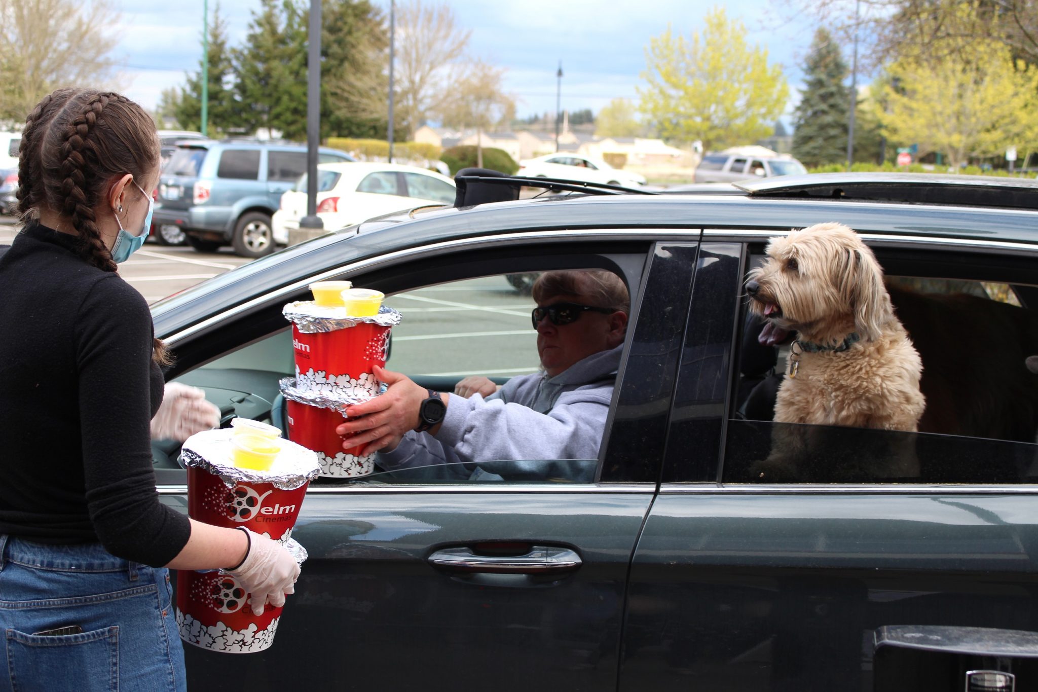 https://www.thurstontalk.com/wp-content/uploads/2020/05/Yelm-Cinemas-Drive-Thru-Popcorn-Event-Whole-Family-2048x1365.jpg
