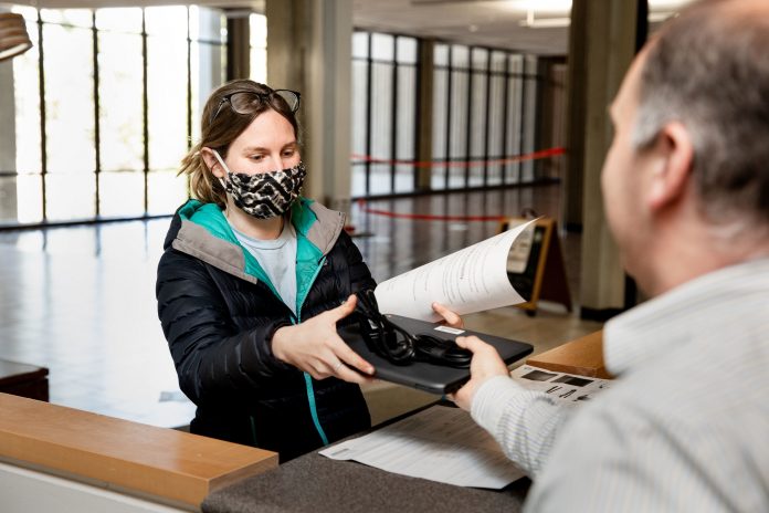 An-Evergreen-student-checks-out-a-laptop-from-the-college-library.-Evergreen-was-just-awarded-3.1-million-in-grants-to-strengthen-student-services
