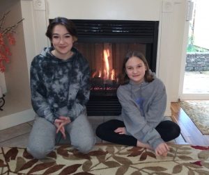 Olympia COVID health Quinn-and-Dynah-Carte-by-fireplace