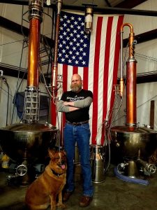 Tenino-Sandstone-Distillery-John-Bourdon-stills-and-flag