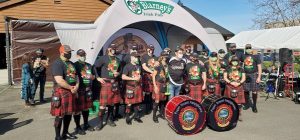 Puget Sound Firefighters Pipes & Drums pose outside O'Blarney's Irish Pub in Olympia 