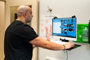 Dr. Saleh at his standing computer at Foot & Ankle Surgical Associates