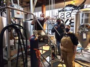 South Puget Sound Community College craft brewing and distilling program intern Eric Wilcox, co-founder and owner Alex Maffeo, head brewer Stacey O’Connor.