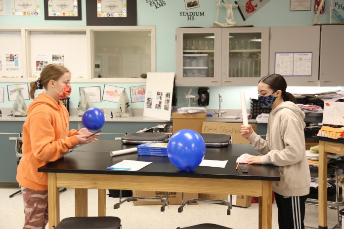 two students working on a science project in the Power-Up! program at North Thurston Public Schools