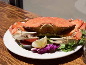 cooked whole crab on white plate