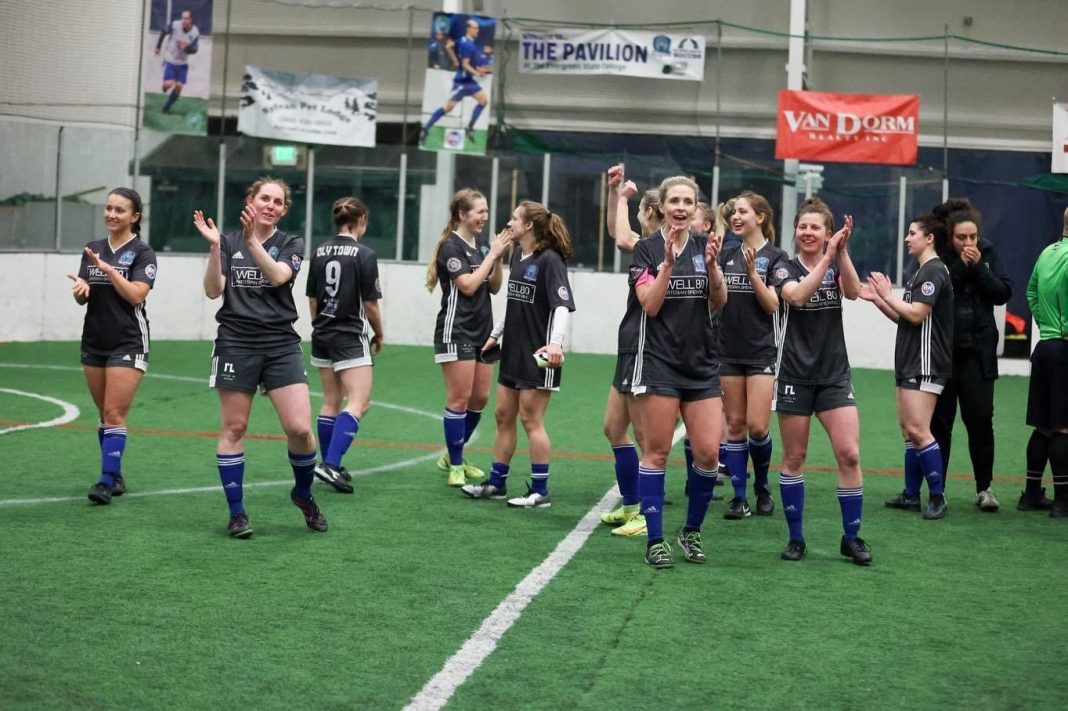The Oly Town women's indoor soccer team celebrates a win at the Evergreen State College Pavilion.