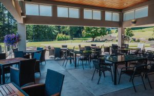 Olympia Country & Golf Club covered patio with tables and chairs for events