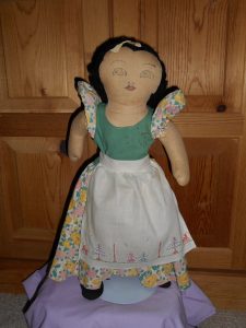 Vintage Snow White doll in a white and green dress from1938