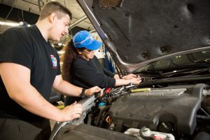 South Puget Sound Community College Students working under the hood of a car