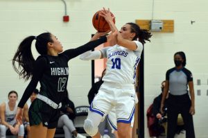 SPSCC freshman Sharay Trotter fighting to hold ball against opponent 