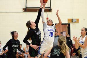 South Puget Sound Community College women's basketball player stopping a basket from an opponent