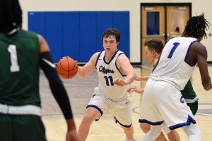 Community College Basketball player Ethan Dillon dribbling