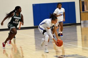 Sharay Trotter scopes up a loose ball during the Clippers home win over Green River. 