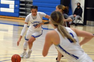 Two SPSCC women's basketball players on the court