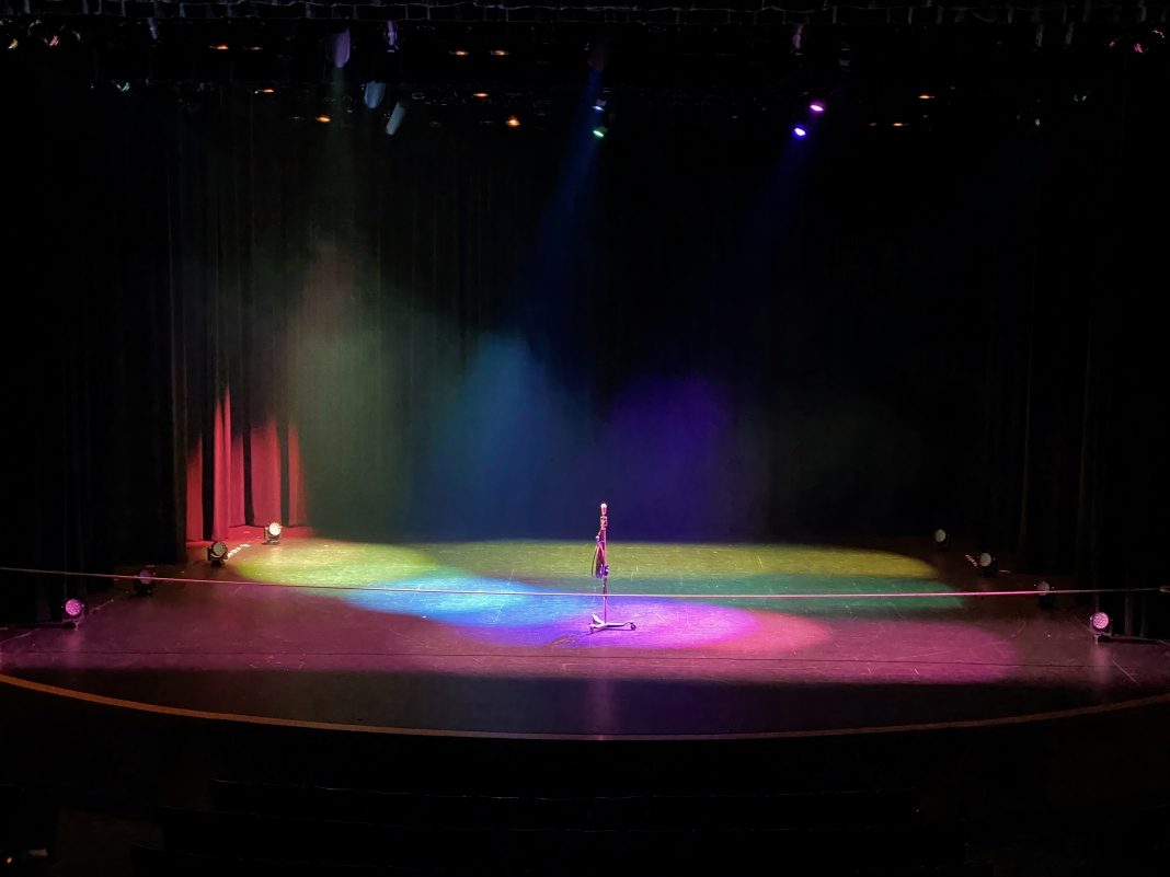 stage lit in multicolored lights at the Washington Center for the Performing Arts