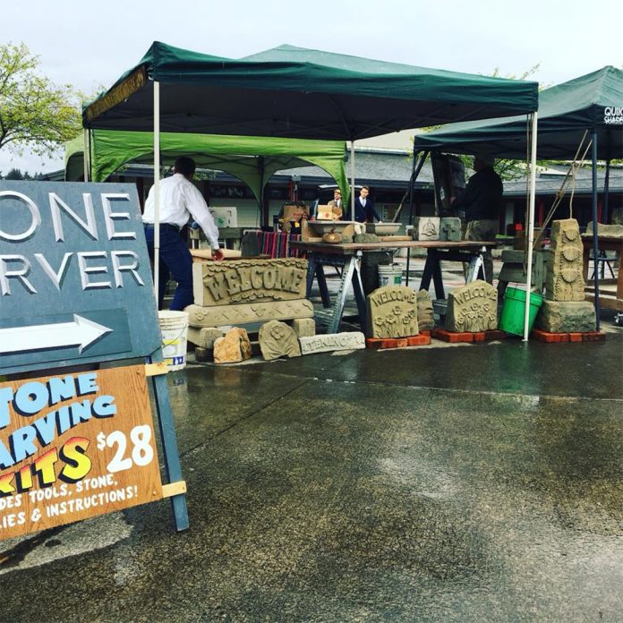 Yelm-Chamber-Home-Show-Outdoor-Booth Pop up tents with merchandise in them set up outside at The Nisqually Valley Home & Garden Show