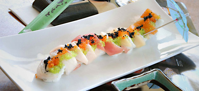 plate of brightly colored sushi rolls
