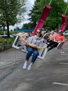 people on a swing ride at the Lacey Spring Fun Fair