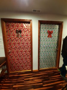 two doors decorated in the Coastal Community Action Program Youth Shelter