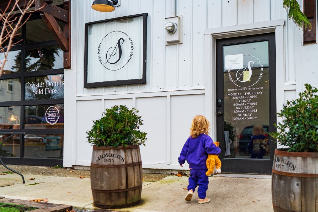 a small child heading towards the door at the Shiplap Shop & Coffeehouse