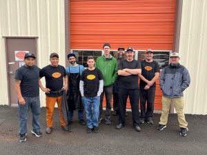 farm to fit team standing outside warehouse