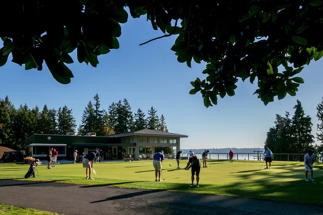 golf course with people playing at Olympia Country and Golf CLub