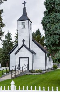 outside view of the historical Rainier church, painted white