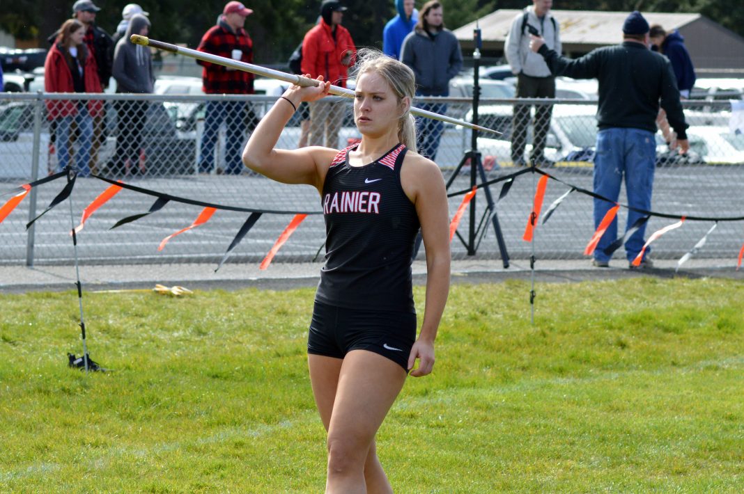 Rainier High School senior Isabella Holmes holding the javelin