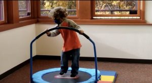 young child playing on a small trampoline at South Sound Parent to Parent