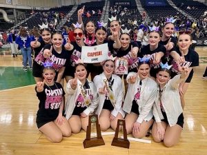 Capital HIgh School Dance team group shot with trophies