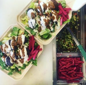 Nineveh Assyrian falafel salad on table