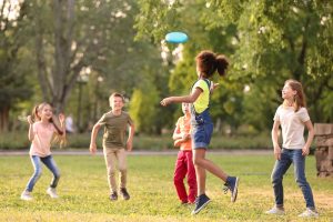 kids playing frisbee at a Lacey Park