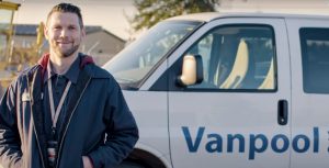 Intercity Transit Vanpool van with man standing in front of it