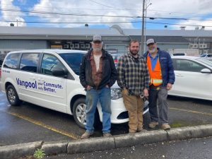 Stephen Little, along with brother-in-law and nephew, Rob and Nick Thompson standing in front of a Intercity Transit Vanpool van
