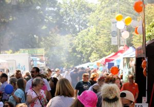 crowds walking down the vendors at the Lacey South Sound BBQ Fesitval