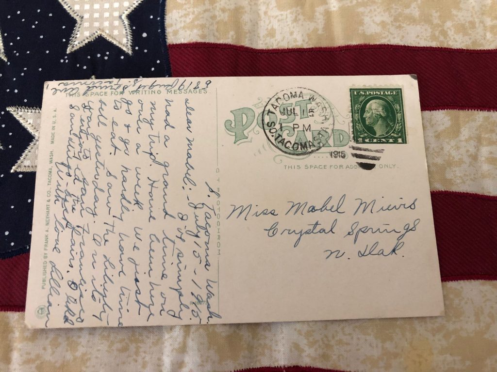 postcard lying on top of an American flag