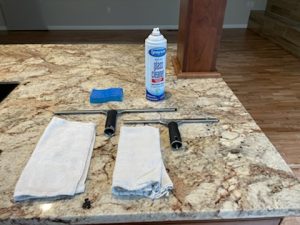 squeegees and diapers laid out on a countertop for window washing with Maid Perfect