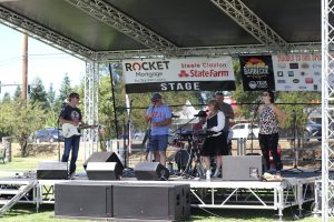 musicians playing on stage at the Nisqually Valley Barbecue Festival